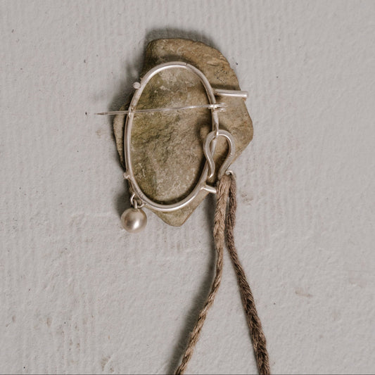 river stone brooch two