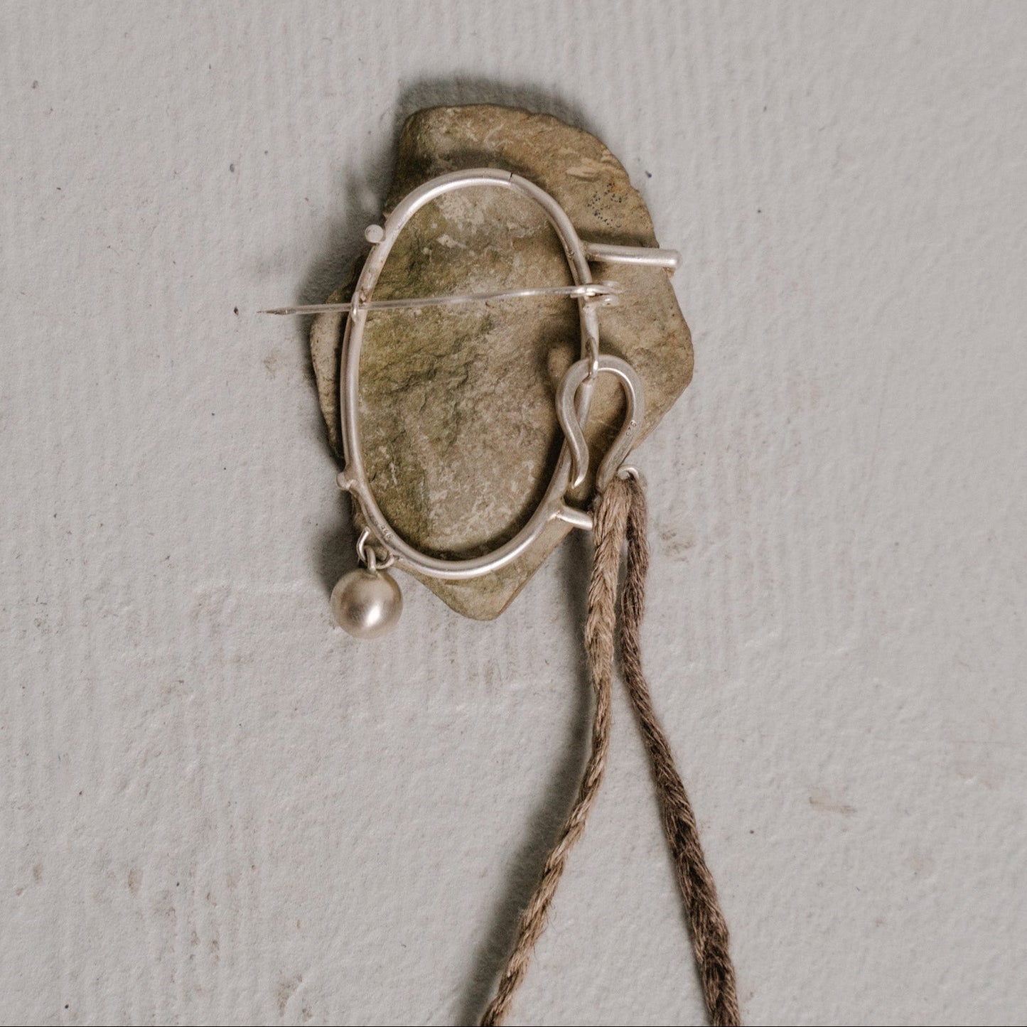 river stone brooch two