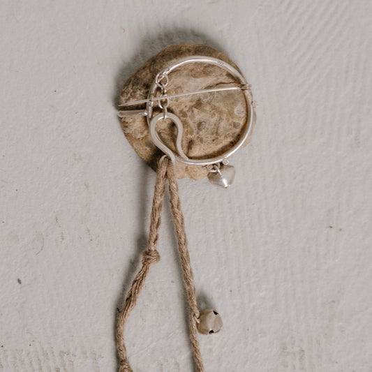 river stone brooch one