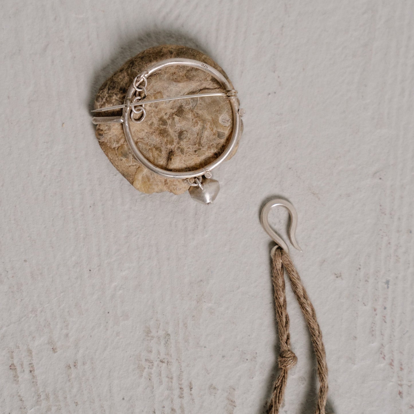 river stone brooch one